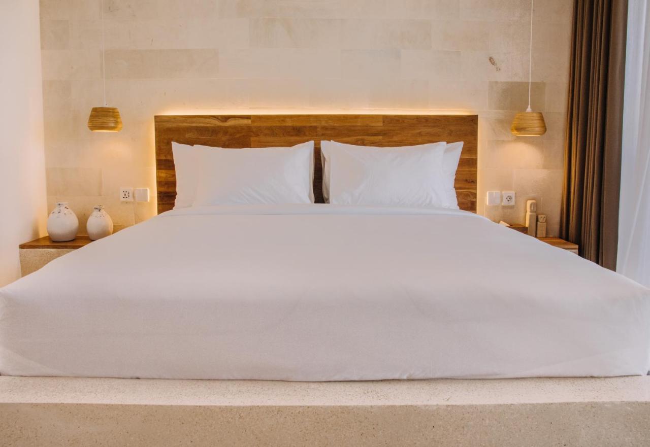 Neano Escape Hotel Manggis  Luaran gambar A bed with a mattress and a bed frame
