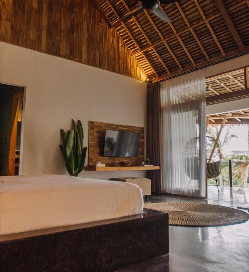 Neano Escape Hotel Manggis  Luaran gambar A bedroom at the resort